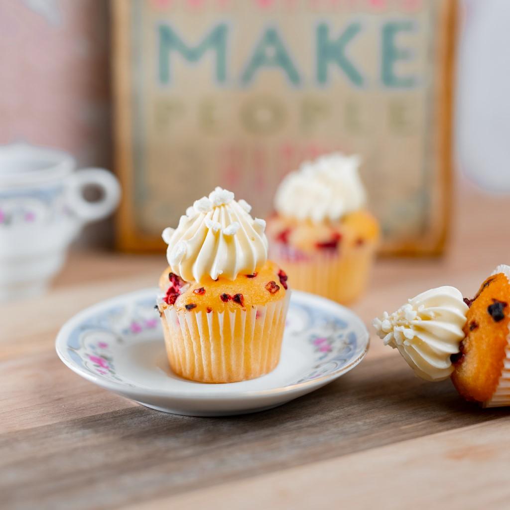 Raspberry white chocolate cupcake with drizzle